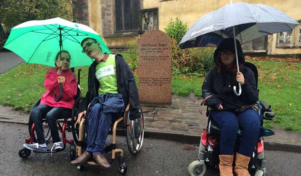 Ambassadors in the rain with umbrellas 