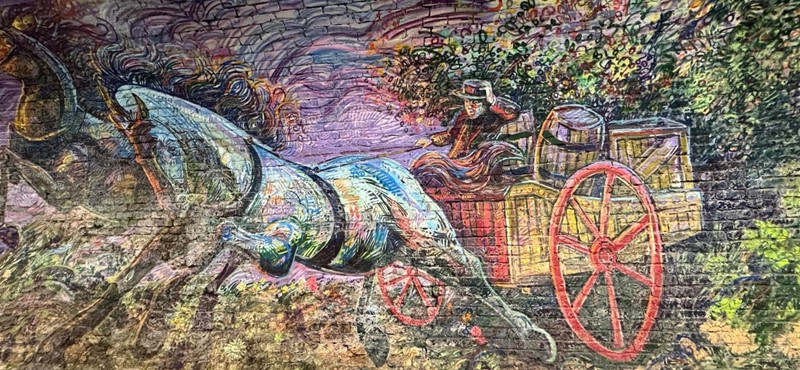 Painting on the tunnel wall of colourful horse and carriage in Colinton Tunnel Mural