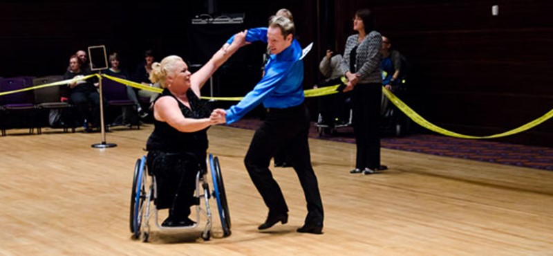 Two people dancing in a competition.