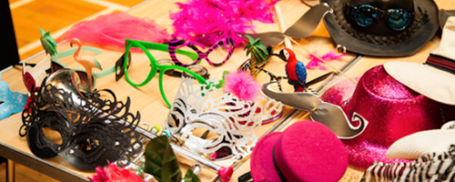 Photo of colourful masks and glasses for fancy dress.