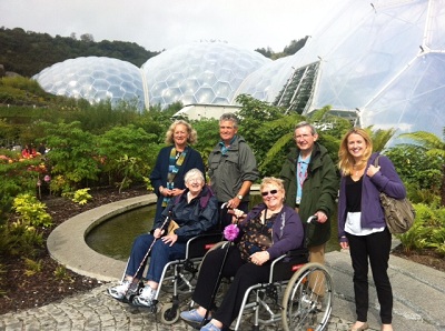 A group of people standing outside the Eden Project 