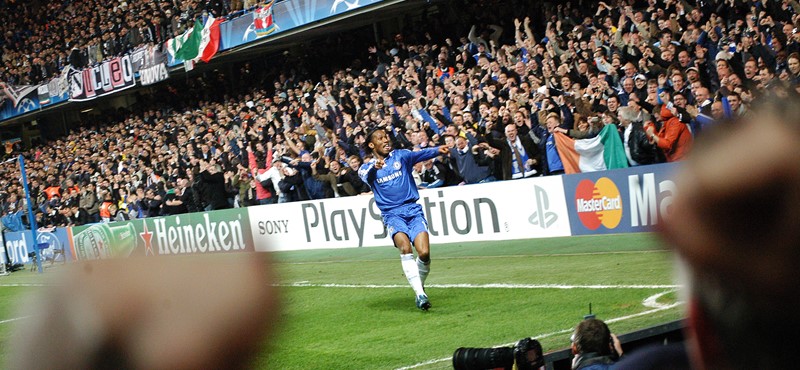 A photo of a footballer during a match.