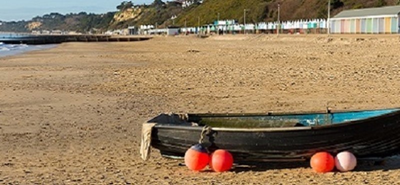 Photo of a boat on a beach.