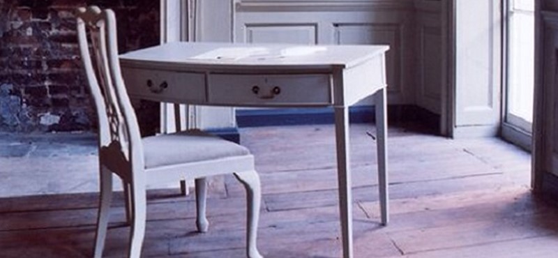 Photo of a writing desk inside an old house.