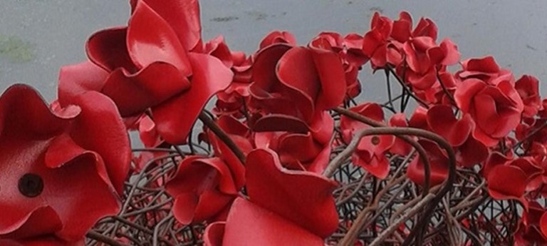 Photo of poppy sculpture.