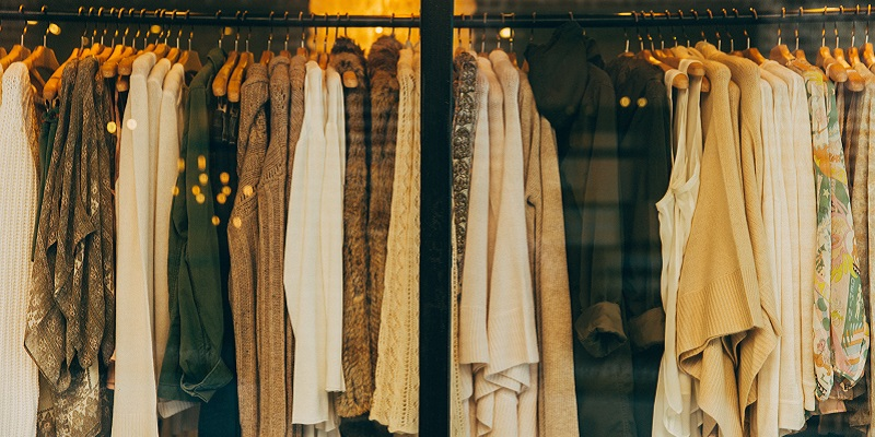 Photo of clothes in a shop window display.