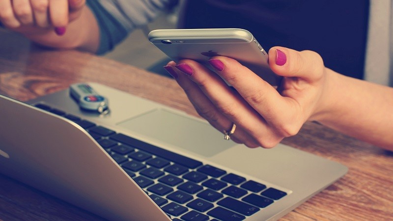 Photo of a person using a laptop.