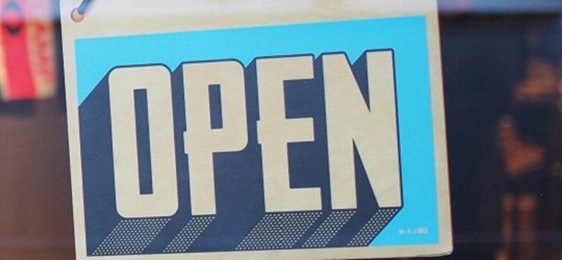 Photo of a shop open sign.