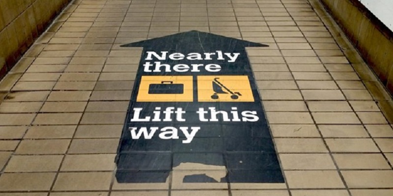 Photo of a directional floor sticker in the Tyne and Wear Metro.