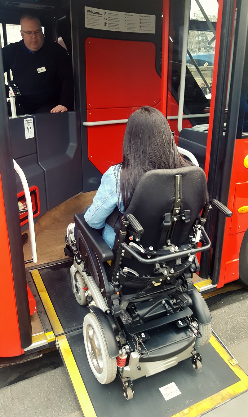 Photo of Emma boarding the bus.