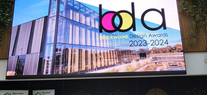 An image of the Blackwood Design Awards logo and marketing slide on a big screen.