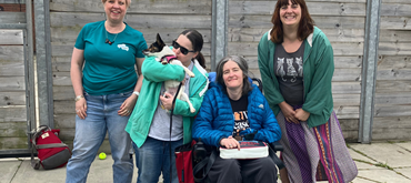 A photo of the Euan's Guide team with Daisy the dog