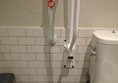 Picture of EAT, One New Change - Accessible toilet with red cord tied up out of reach around a grabrail.