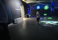 Image of a child in a dark display area