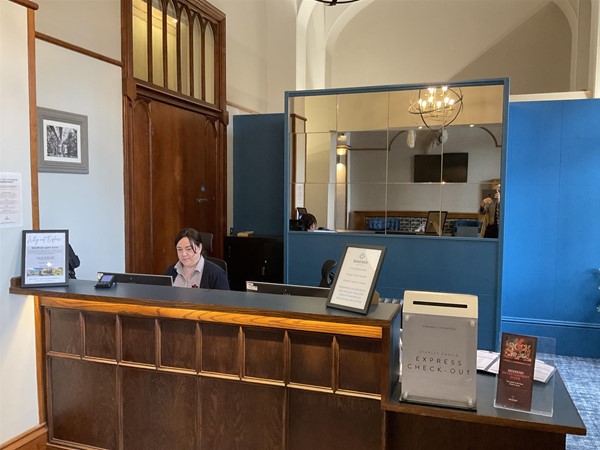 Image of a person at a reception desk
