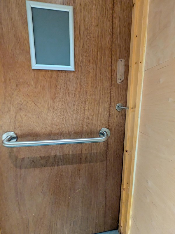 Image of grabrail on the back of the door