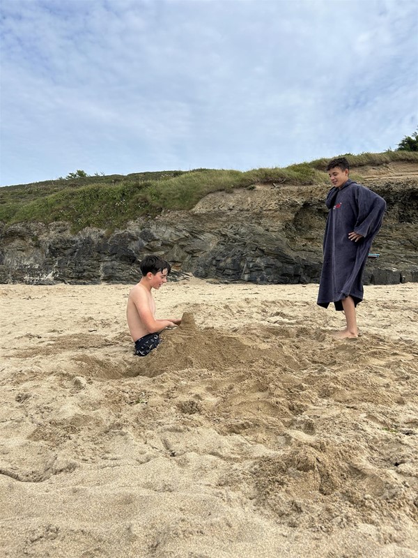 Image of two people on a beach