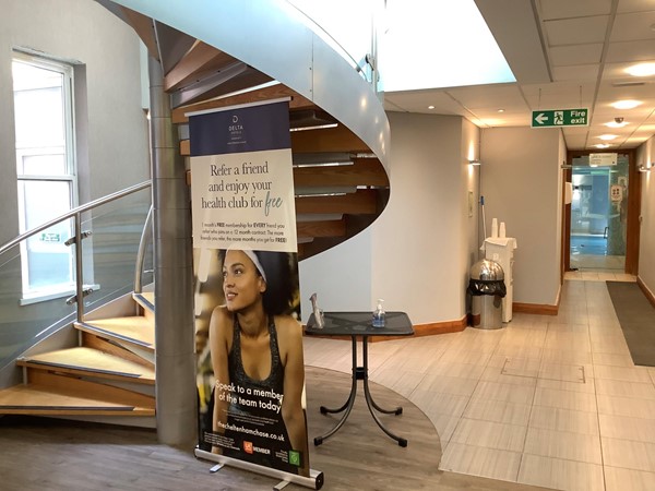 Health club poster and spiral staircase
