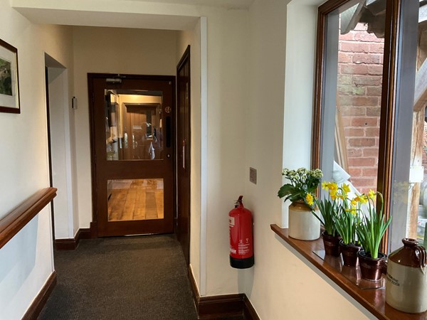 Push the hard and heavy door at the end of a passage