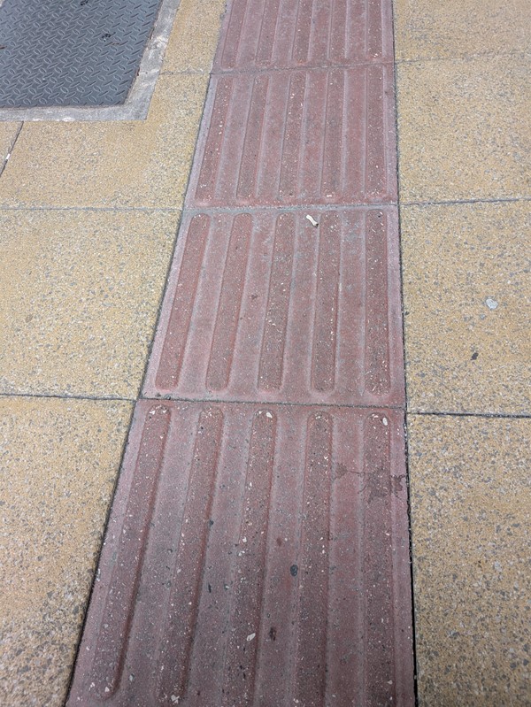 Image of some red and yellow tactile paving