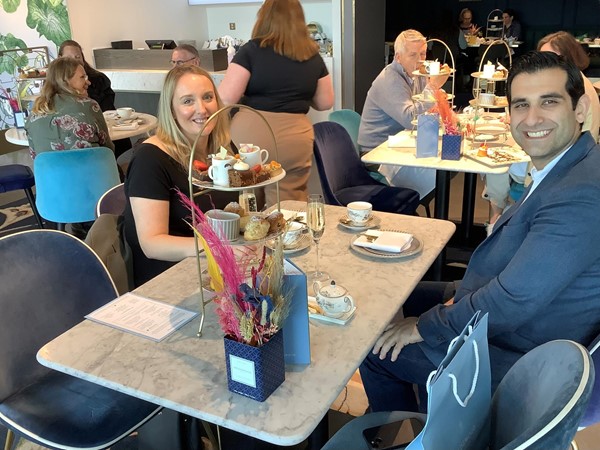 Picture of people with a tray of cakes