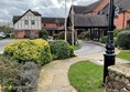 Walk past the main door to reach the path and a ramp to help you get into the hotel