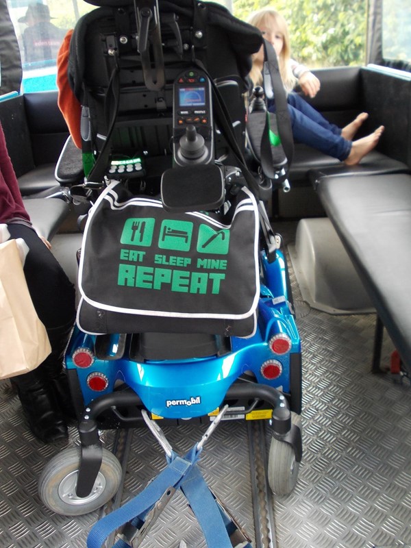 Powered wheelchair locked down on the land train.