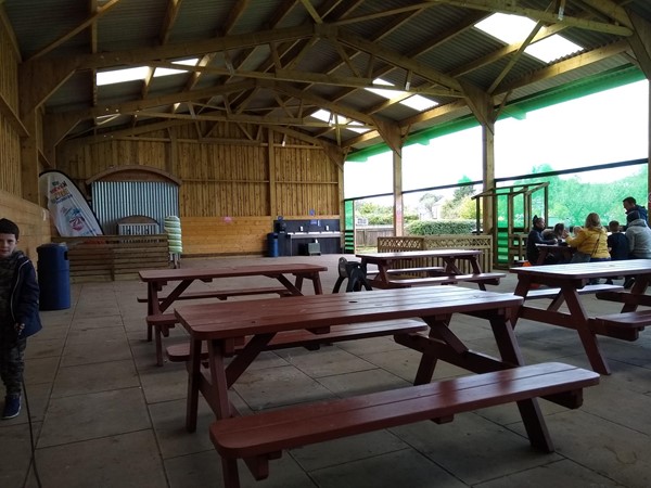 Picnic benches under cover. 1 of 2 barns for this.