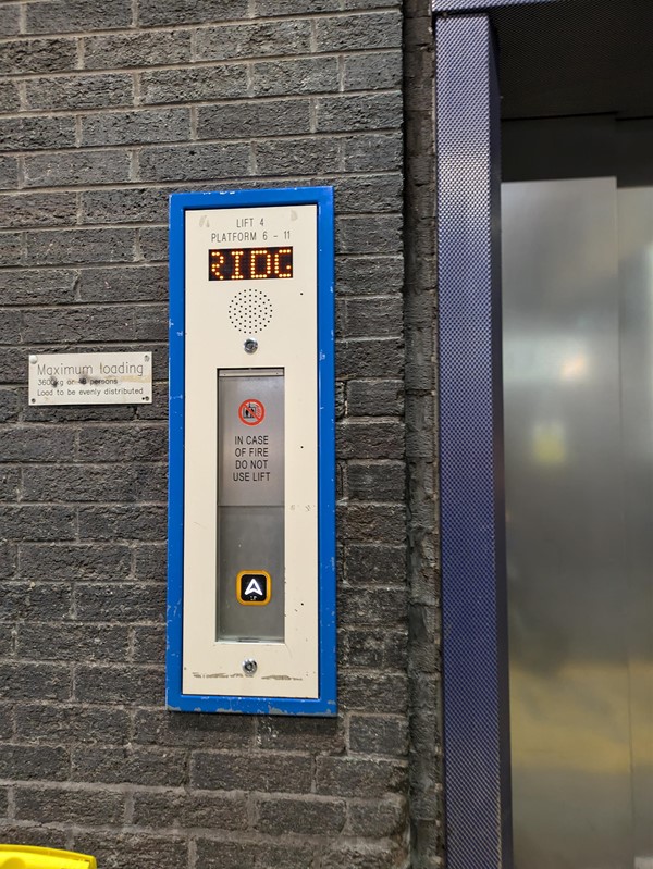 Image of lift access. The lift buttons have braille markings