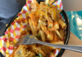 Good menu. Pic shows black tray of chips with onion bhaji and balti sauce.