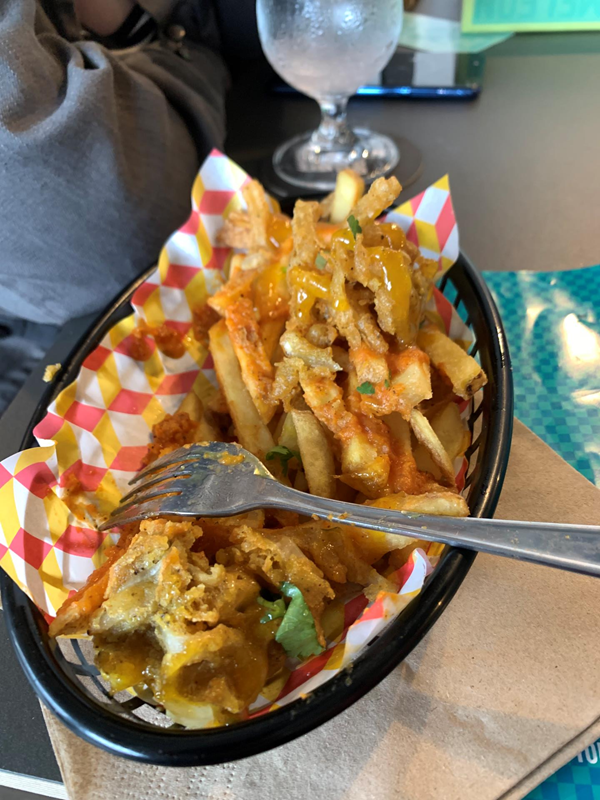 Good menu. Pic shows black tray of chips with onion bhaji and balti sauce.