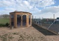 Image of the hut in the dog park.