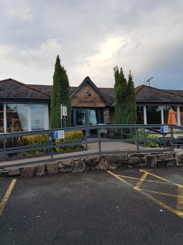 Main entrance to restraunt with lots of disabled spaces