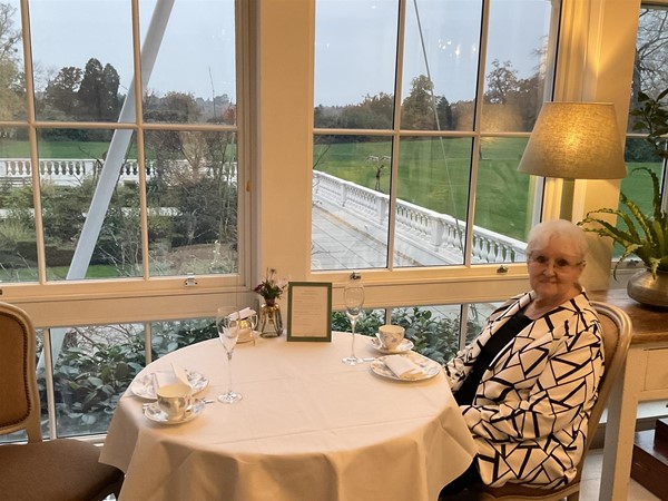 Image of a person sitting at a table
