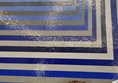 Image of a person in front of a mosaic