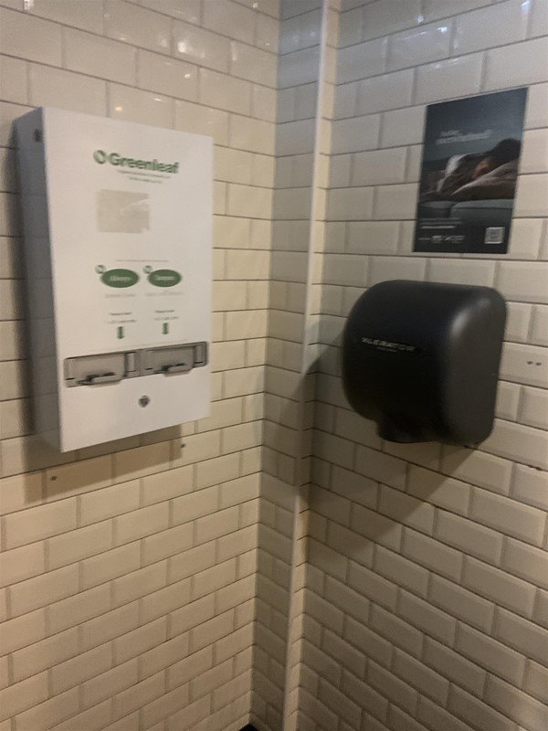 Image of a hand drier and sanitary product dispenser machine