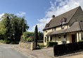Cottages built of the lovely Cotswold stone of honey yellow brick colour.
