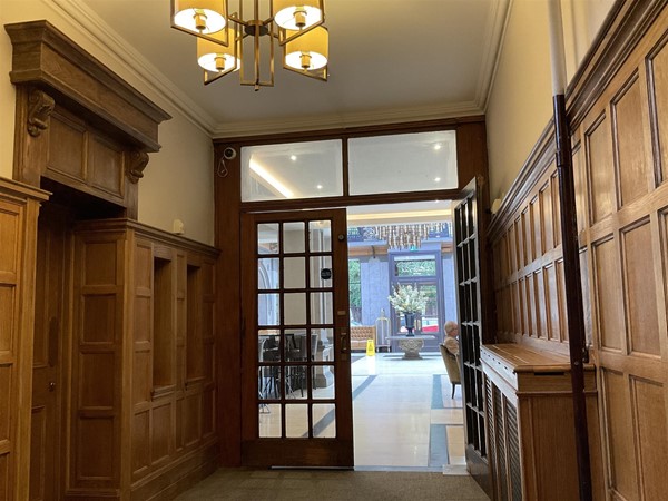 Image of a door in a corridor.