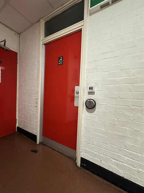Image of accessible toilet door from the outside