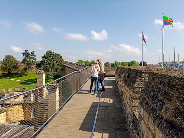 Walls walkway with safety barrier on the left and the wall on the right. Plenty wide enough for most chairs