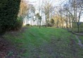 Grass/mud path towards the dog field. It's quite steep going up but then flattish once you're at the top.