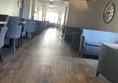 Image of a shiny wooden floor and chairs