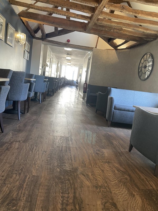 Image of a shiny wooden floor and chairs