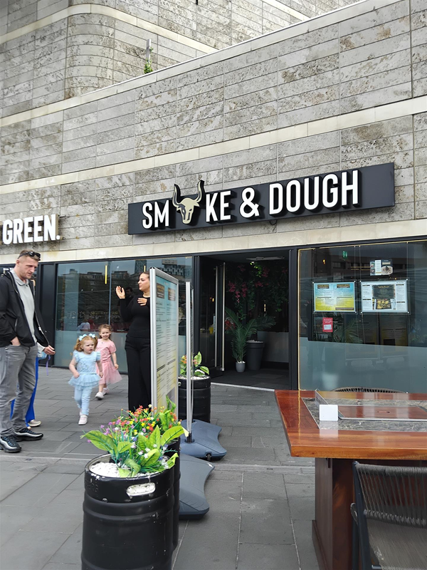 This picture shows the main door in to the venue from the tables outside