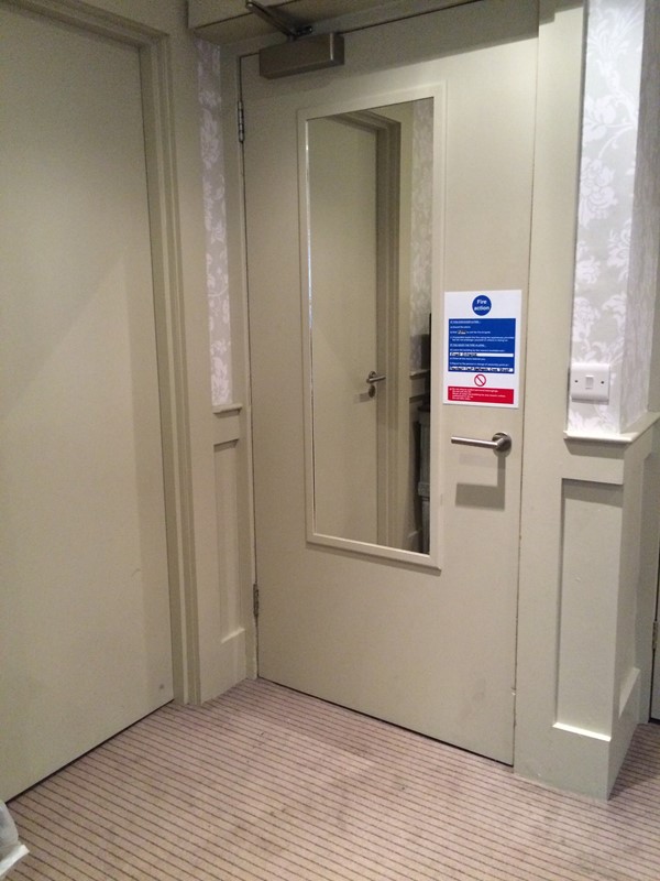 The accessible bedroom’s main door on right and door on the left to the adjoining “bunk”