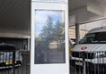 Image of bus station information point with directions and bus timings