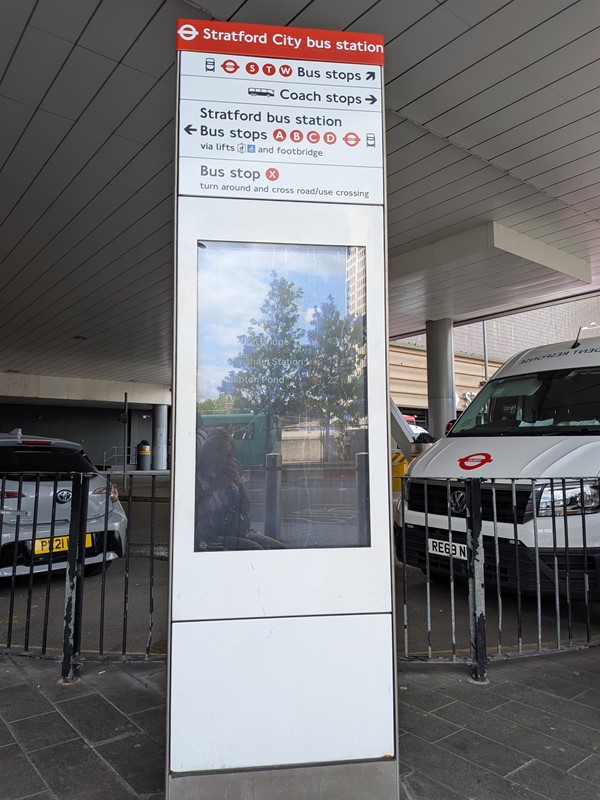 Image of bus station information point with directions and bus timings
