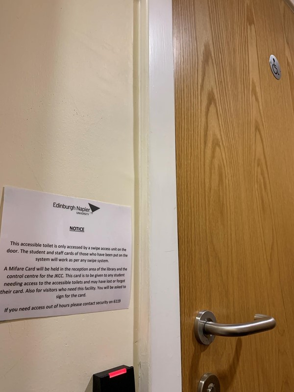 Sign outside toilet door