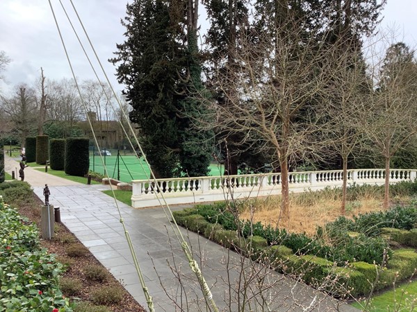 But walking to pass the entrance for the house just continue to the far corner and turn left to follow the path towards the gardens. Then turn left to go along the long path and passing the formal gardens that lead towards the Tennis court