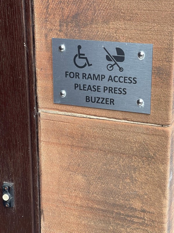 Sign showing wheelchair and pram access